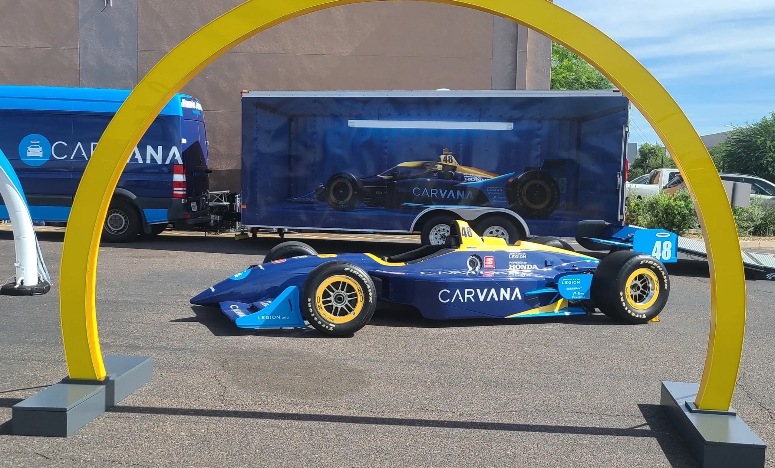 Magnitude team working on a branded vehicle wrap installation