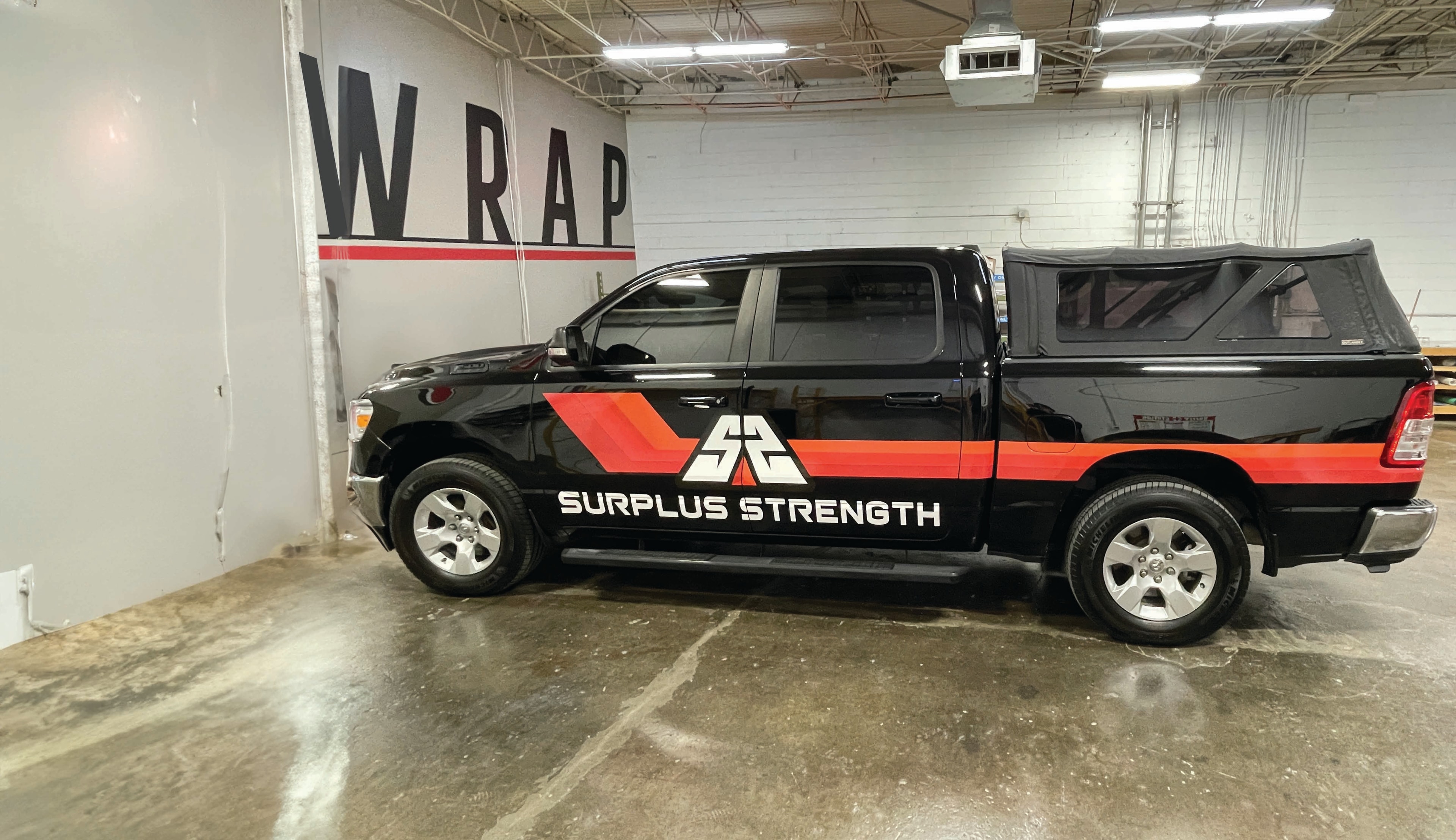 Surplus Strength truck partial wrap — Magnitude